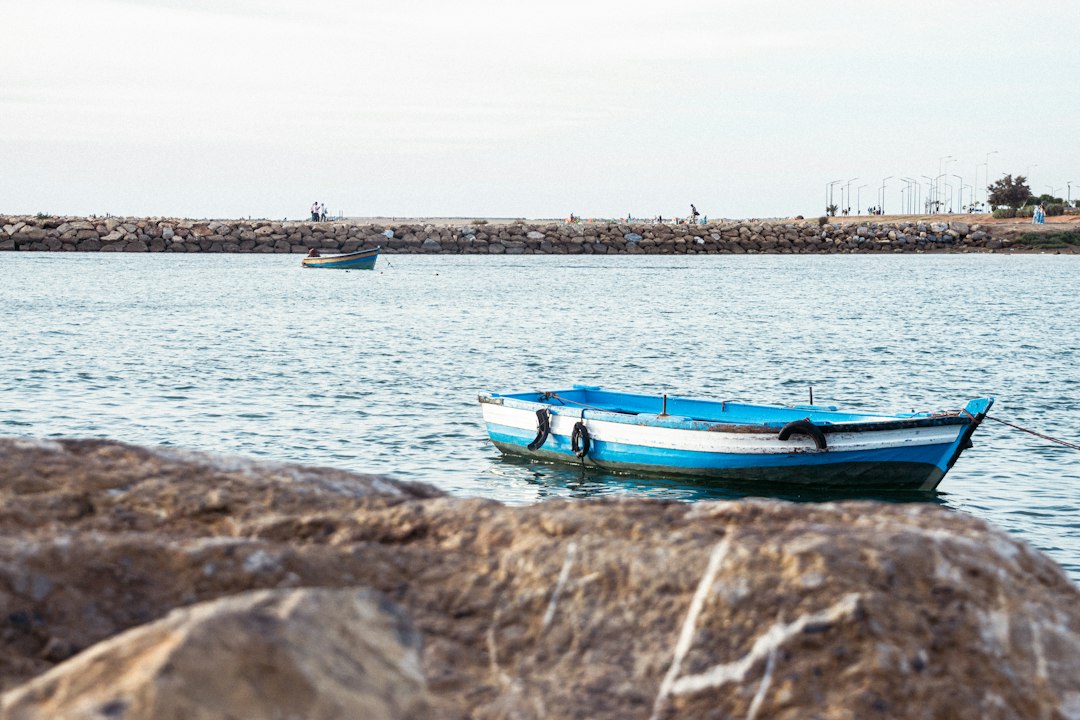 Conclusion by Boat Brands a small blue and white boat floating on top of a body of water