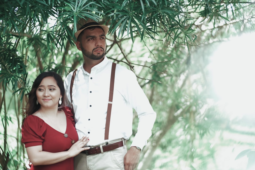 FAQ by Boat Brands a man standing next to a woman under a tree