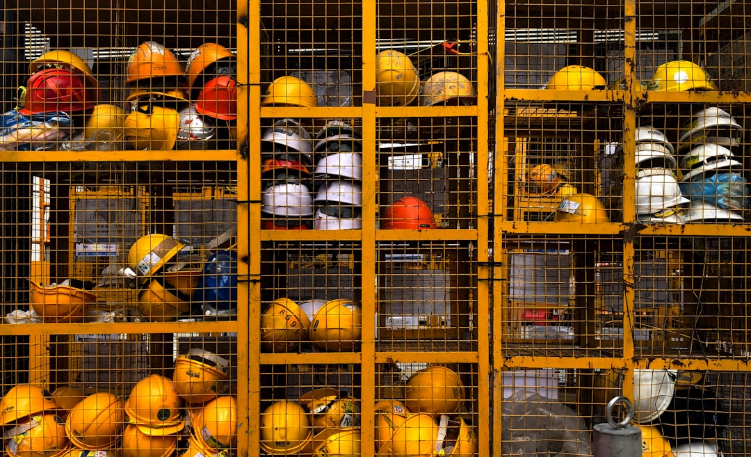 Construction helmets by Boat Brands a rack filled with lots of yellow hard hats