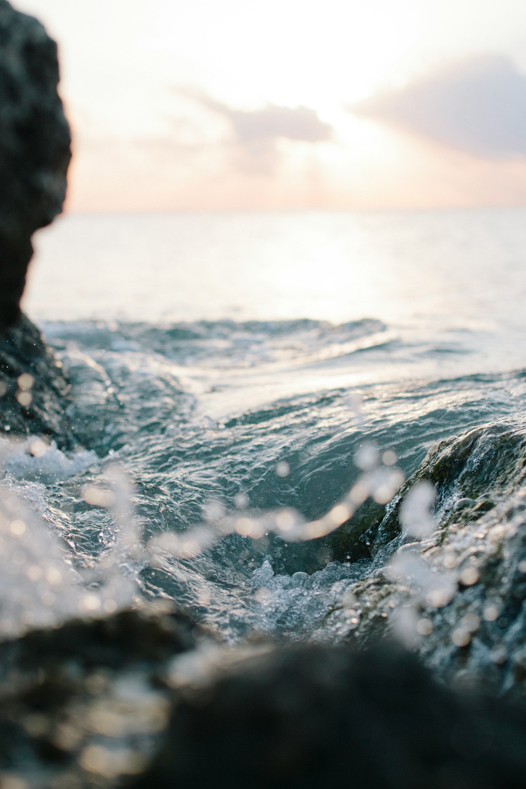 Sunrise in Palm Beach by Boat Brands ocean wave at the rocky shore