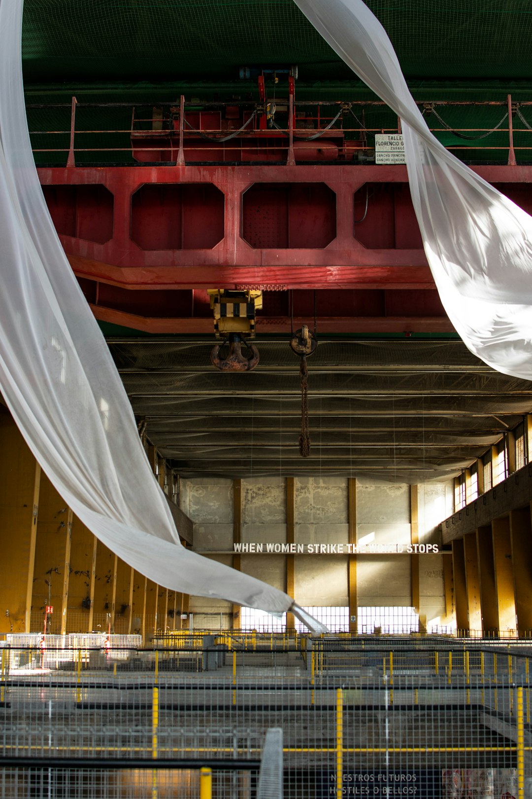 A large building with a lot of white fabric hanging from it's ceiling