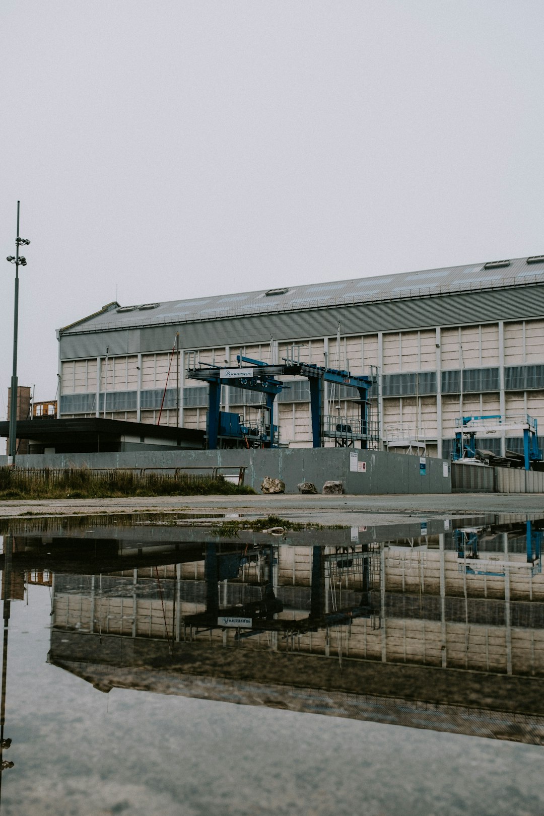 a large building with a crane in front of it
